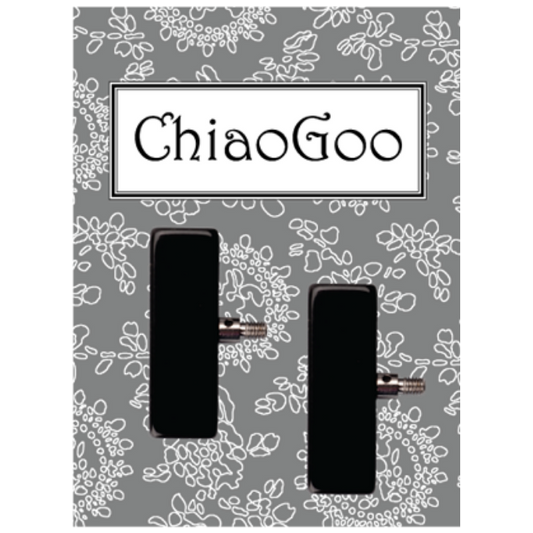 ChiaoGoo Verpackung mit zwei schwarzen Endstoppern auf grauem Blumenmuster-Hintergrund — Seil-Endkappen für Small- und Large-Seile.