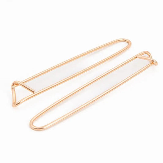 Zwei Rose Gold Stitch Holders aus Metall auf weißem Hintergrund – kaufen in Hamburg