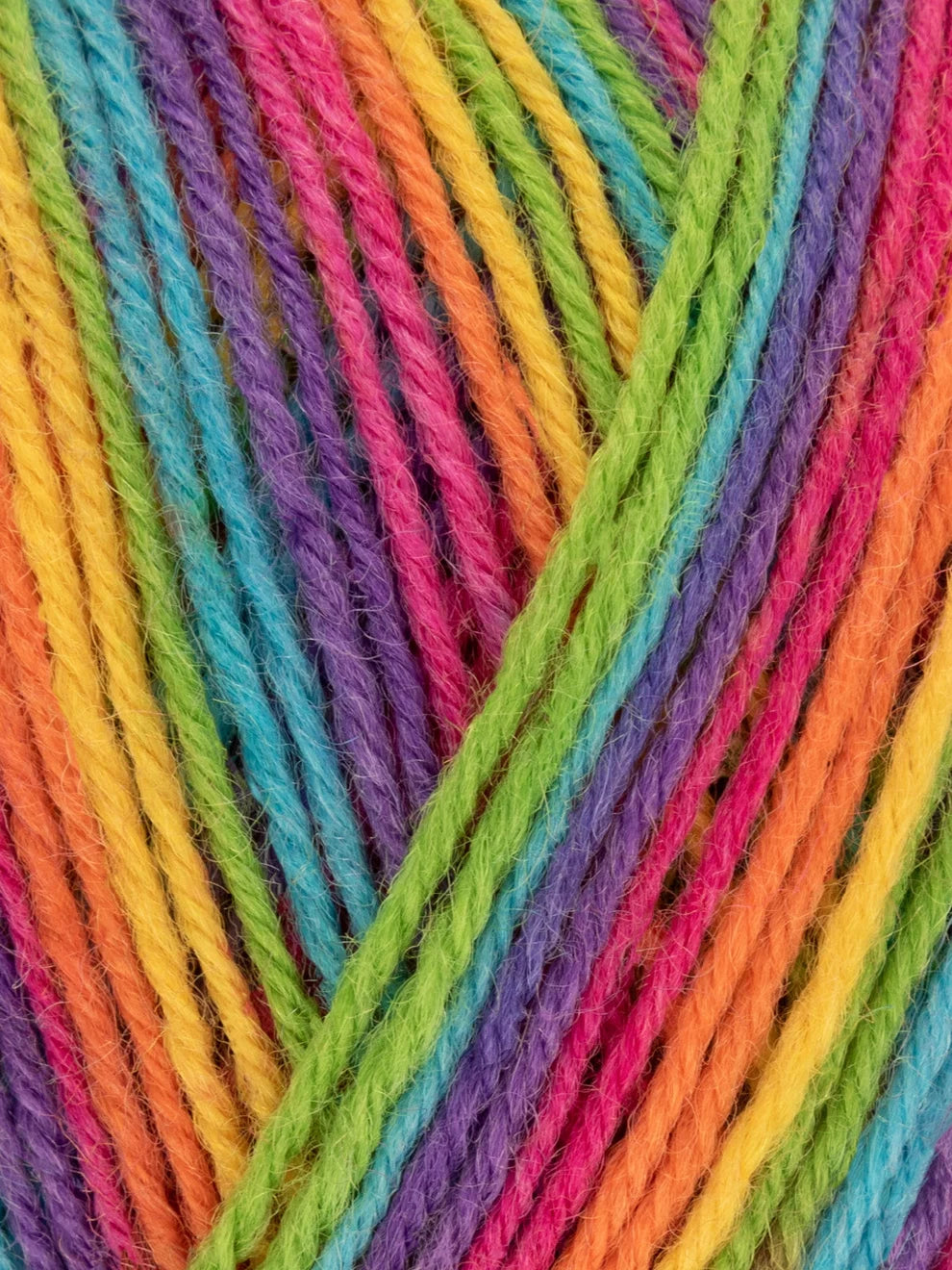 Detailaufnahme der West Yorkshire Spinners Signature 4ply Rum Paradise mit bunten Farbabschnitten in Pink, Orange, Gelb, Grün, Türkis und Lila